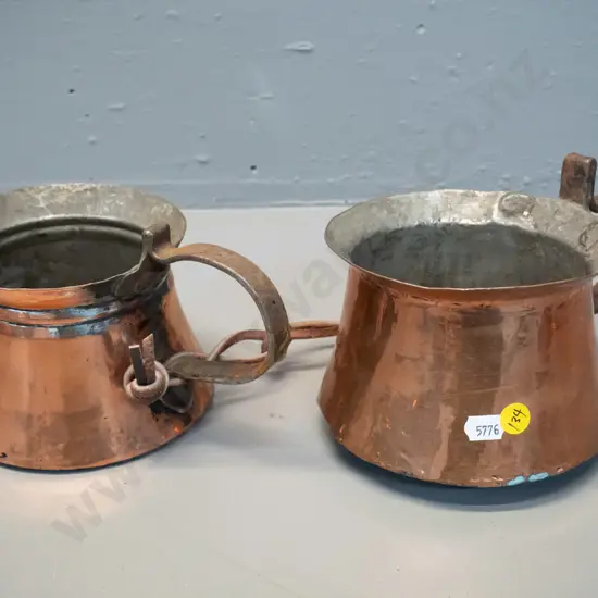 pair vintage copper plated jugs with rustic forged handles, joined with leather strap. Dents and corrosion, slightly