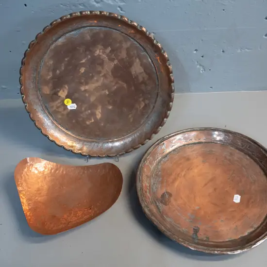3 copper / copper-plated items - beaten copper footed dish and 2 round plated trays, larger with scalloped edge, other
