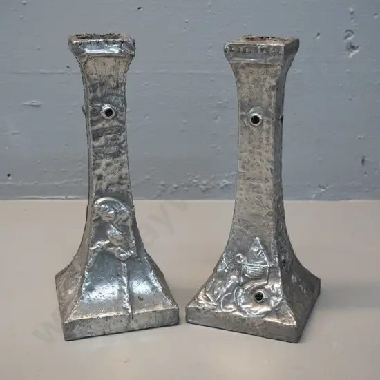 pair of vintage hand-beaten and decorated pewter candlesticks w/ bird and flower motifs, some damage to pewter at top