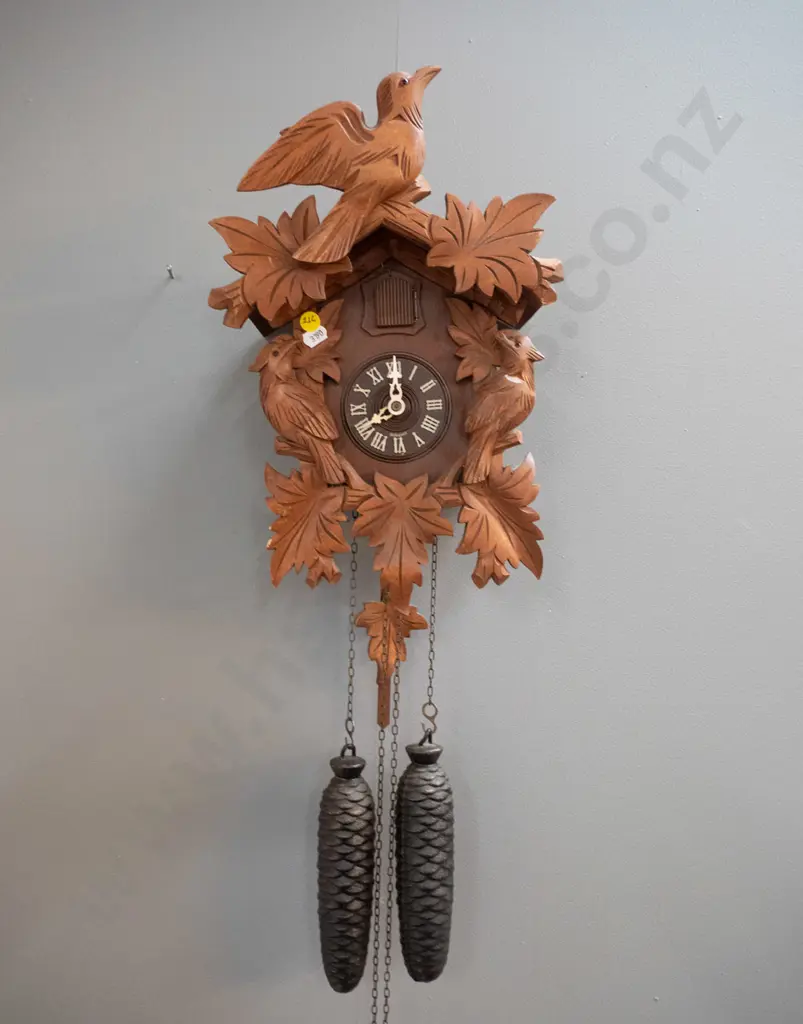 wood-cased cuckoo clock with cast metal weights and plastic face marked Germany - some minor chips to finish (not going) Image 1++