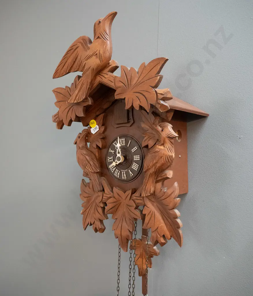 wood-cased cuckoo clock with cast metal weights and plastic face marked Germany - some minor chips to finish (not going) Image 1++