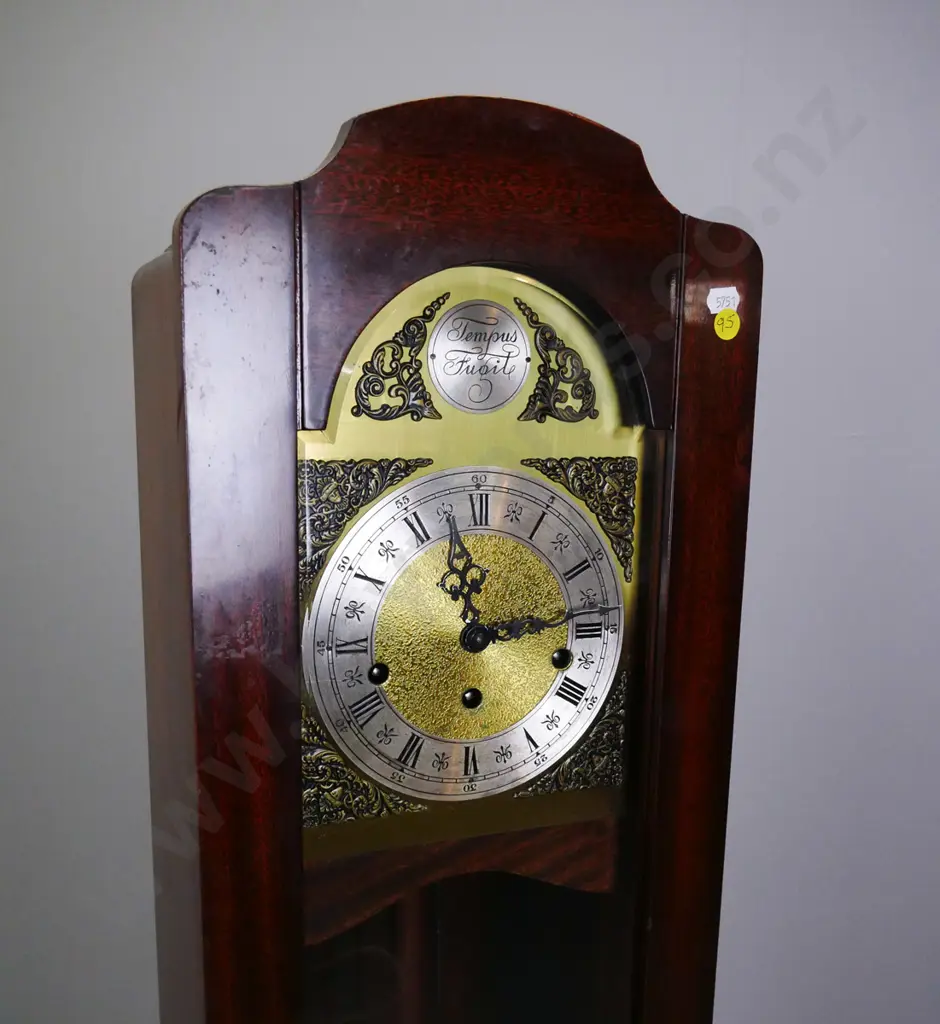 small long-case clock mahogany, glazed door, Tempus Fugit motto on metal dial, engraved spandrels, on plinth base w/cab Image 1++