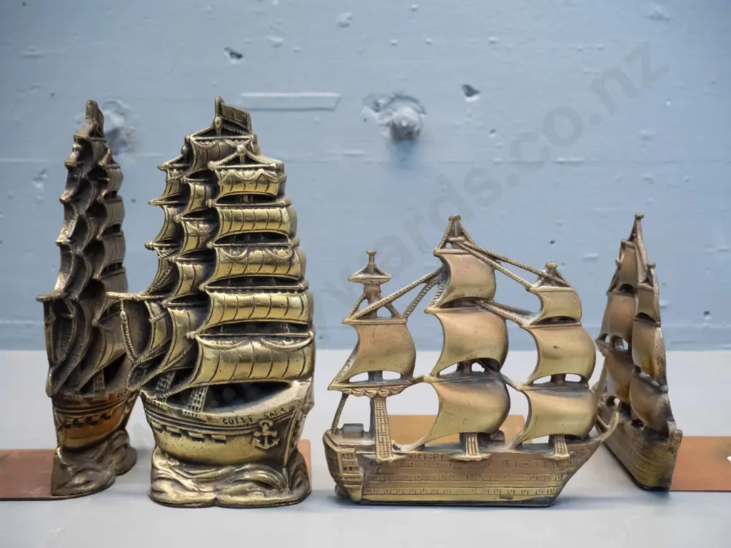2 pair of brass sailing ship-themed book-ends - one pair marked Victory, other Cutty Sark H-180 Image 1++
