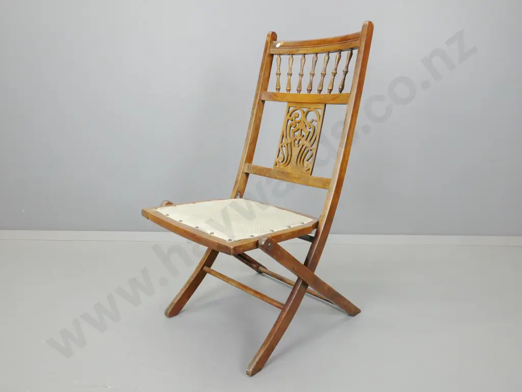 Edwardian beech folding chair with turned spindle gallery - some damage to pierced carved back splat, staining to polish Image 1++
