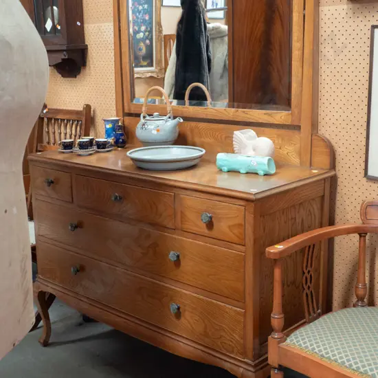 vintage oak & elm dresser with shaped framed bevelled edge mirror, 5 drawers w/ bakelite handles. Plywood back has borer