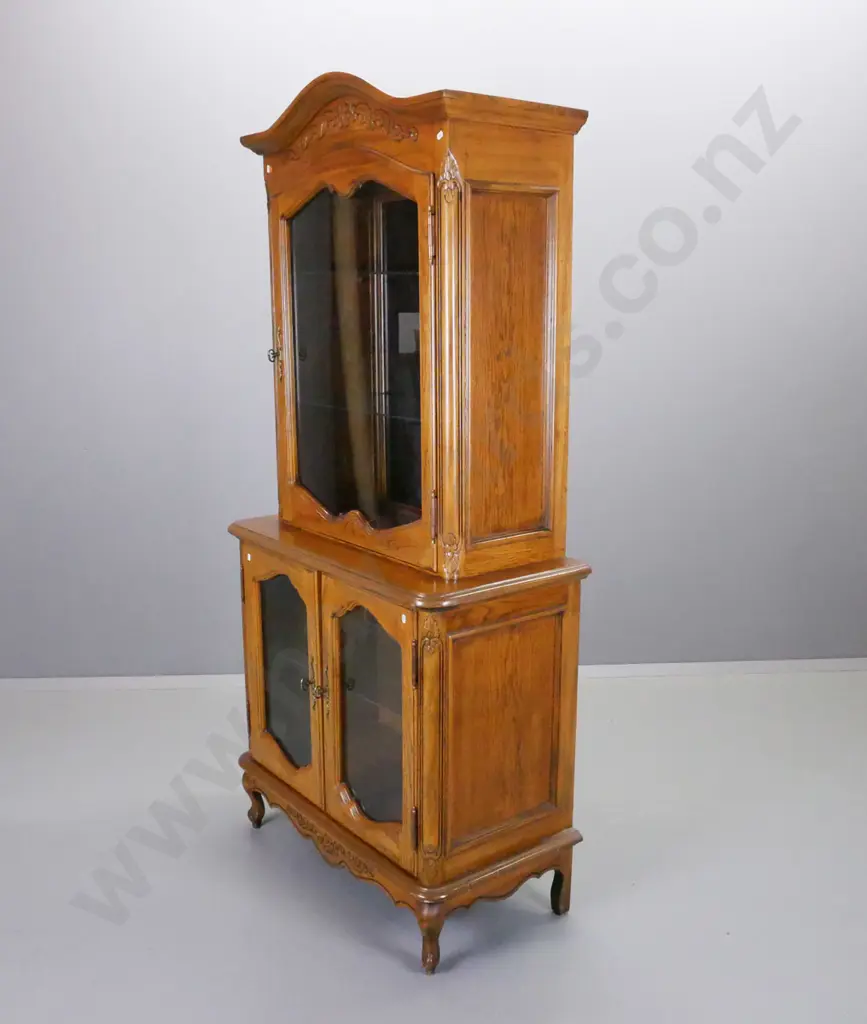 reproduction oak and elm display cabinet with single top and 2 lower glazed shaped cupboard doors, mirrored back on top, Image 1++