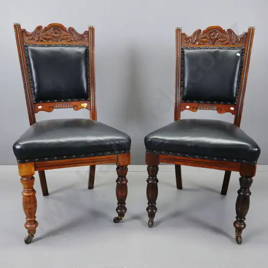 pair of Edwardian mixed timber beech & kauri side chairs, carved foliate decoration to back, fluted uprights, black