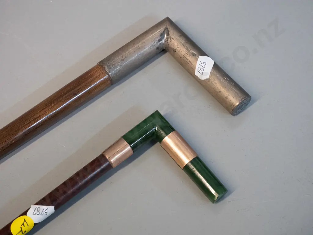 2 walking canes with right-angle heads - one with greenstone handle and hallmarked gold bands L920, other with plated Image 1++