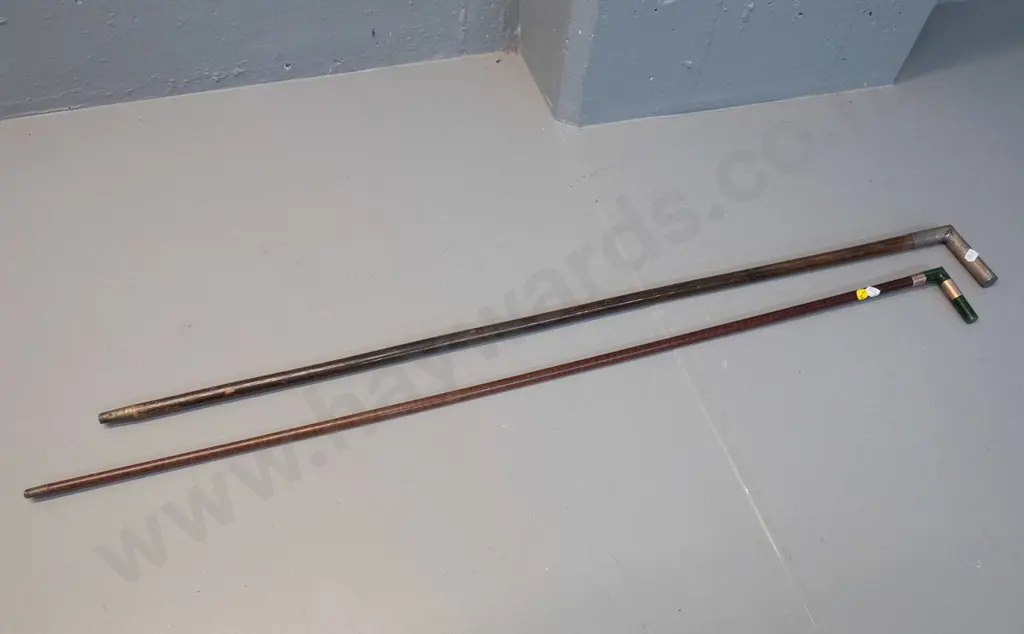 2 walking canes with right-angle heads - one with greenstone handle and hallmarked gold bands L920, other with plated Image 1++