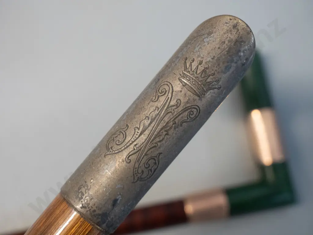 2 walking canes with right-angle heads - one with greenstone handle and hallmarked gold bands L920, other with plated Image 1++