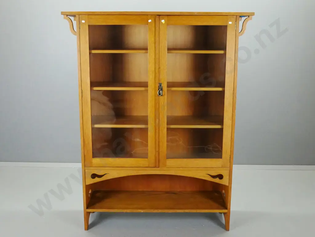 vintage oak arts & crafts style display case w/ 2 glazed doors, 3 shelves, above single open shelf, pierced cutouts to Image 1++