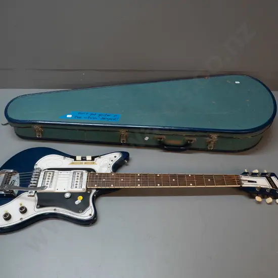 Commodore electric guitar and case, made in New Zealand circa 1962 according to note - with Vibratone. Foam inside gone