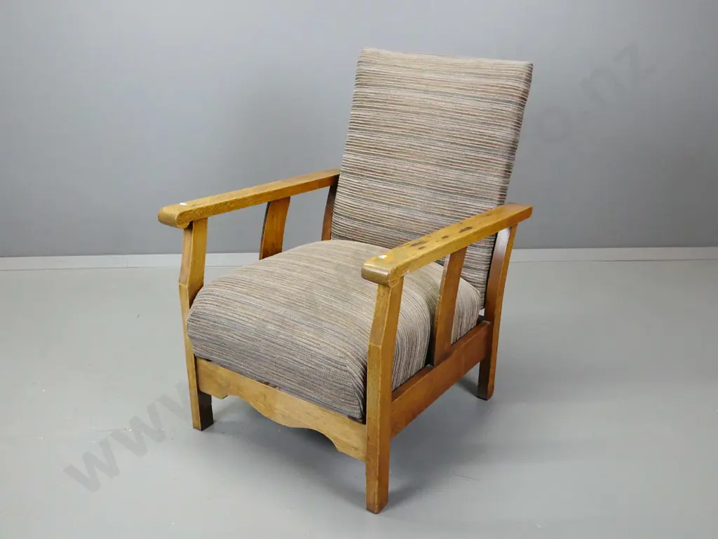 vintage oak Morris chair with sprung upholstered seat, brass adjustment bar to back. Some staining to polish on arms. Image 1++