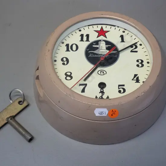 Russian submarine clock in heavy cast metal case with key - some chips to enamel D-200