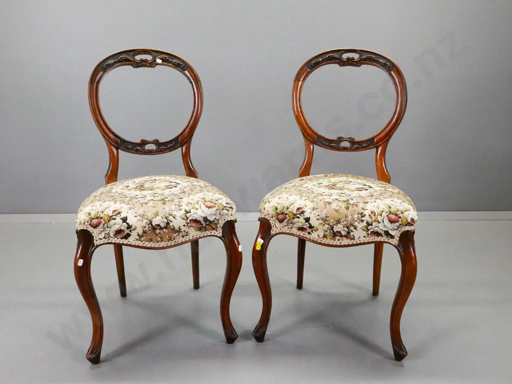 pair of Victorian walnut balloon back side chairs with pierced foliate carving to back, on sweeping corded cabriole legs Image 1++