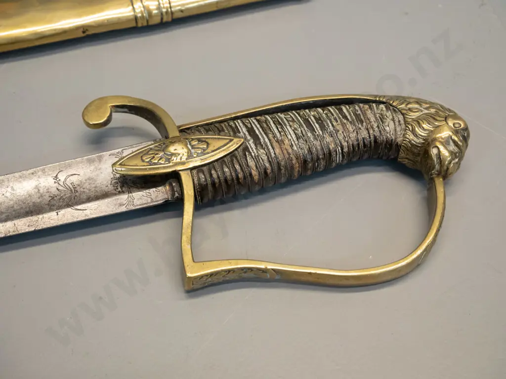 vintage decorative sword with cast brass lion's head, timber and plaited metal cord handle, brass scabbard, some hard to Image 1++