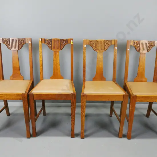 4 arts & crafts style oak splat back dining chairs with carved lily motifs, square tapered legs, brown vinyl pop-out