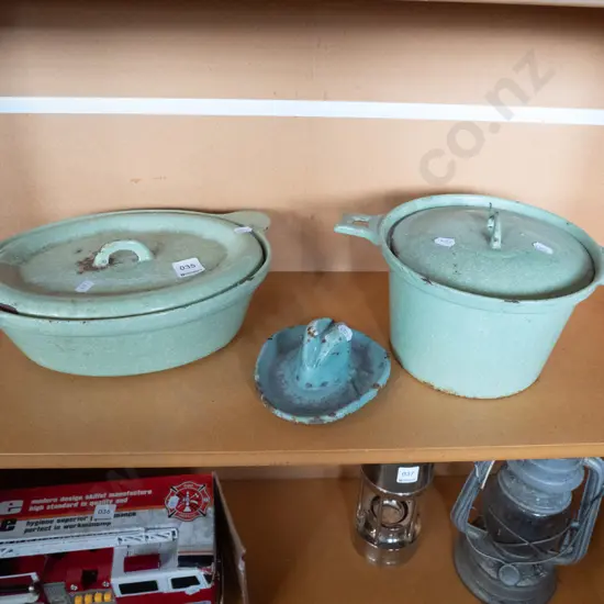 green speckled enamel and cast iron casseroles and a cowboy hat ashtray