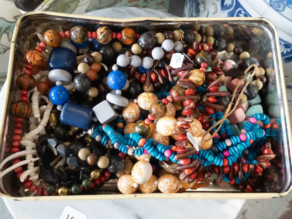 tin of costume jewellery Image 1++