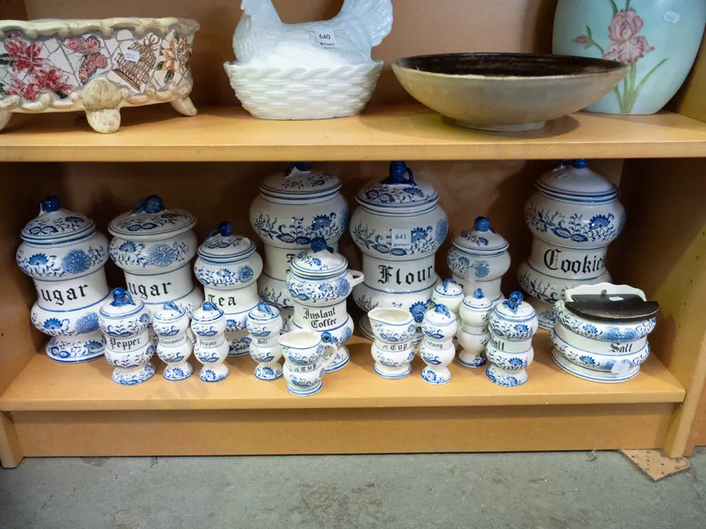 large assortment of blue and white kitchen canisters, salt & pepper shakers, jugs etc. Image 1++