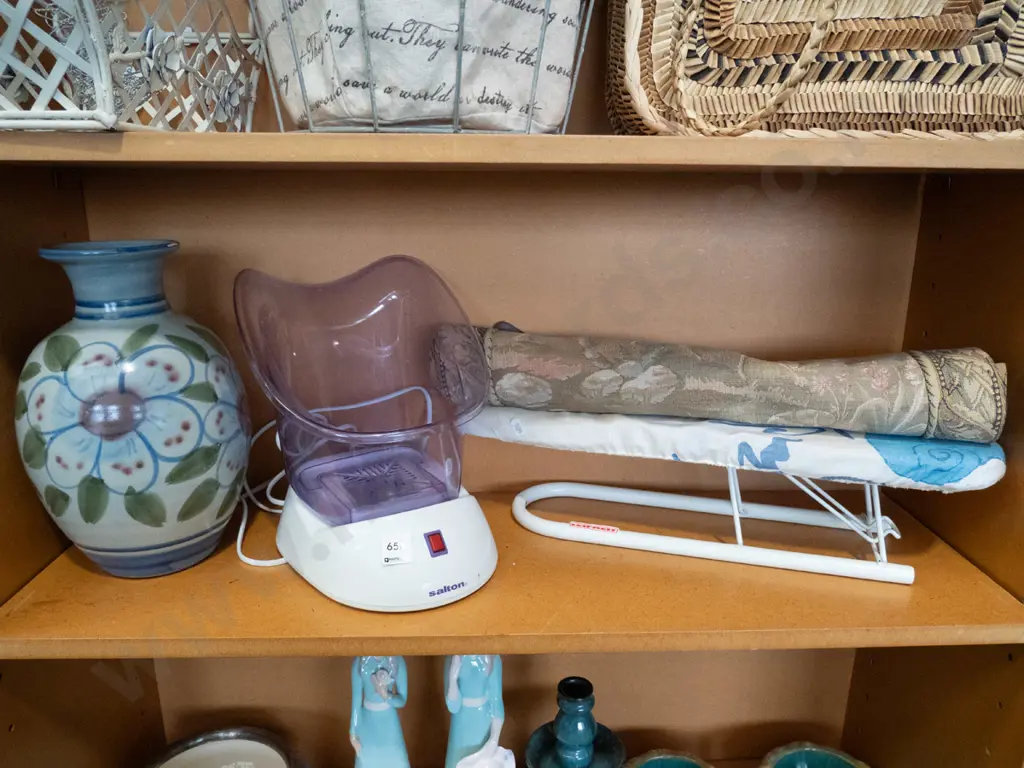 shelf; ironing board, face steamer, pottery vase  Image 1++