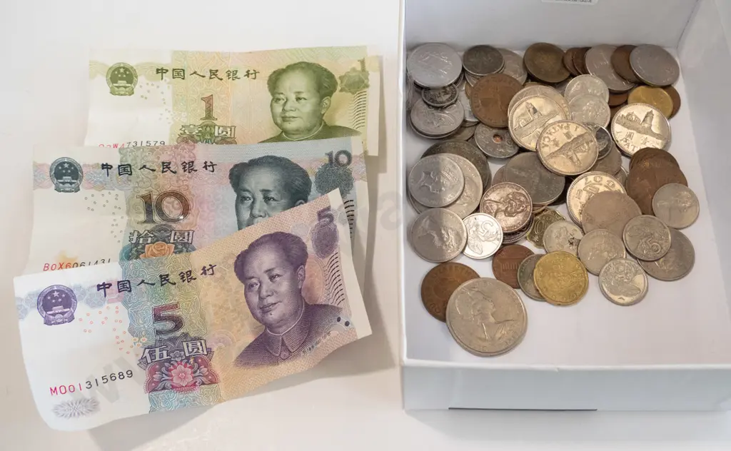 box of coins and notes Image 1++