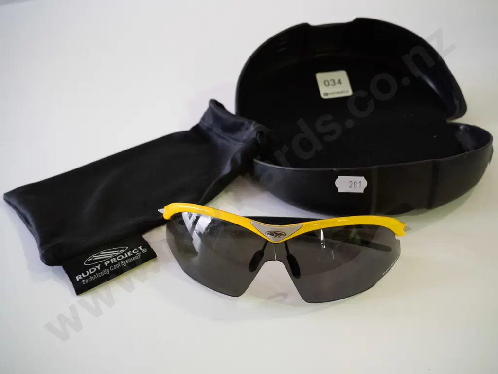 pair of cased Rudy Project sunglasses Image 1++