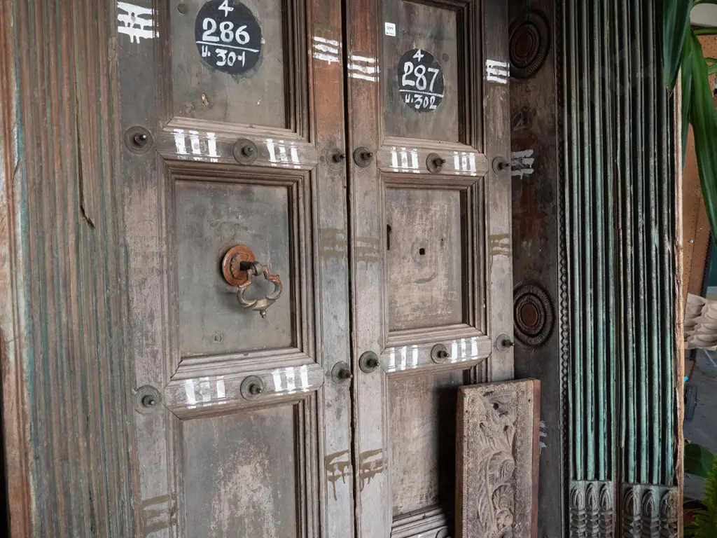 heavy Indian Madurai carved hardwood entrance door - 2 doors, cast metal drop handle, metal studding Image 1++