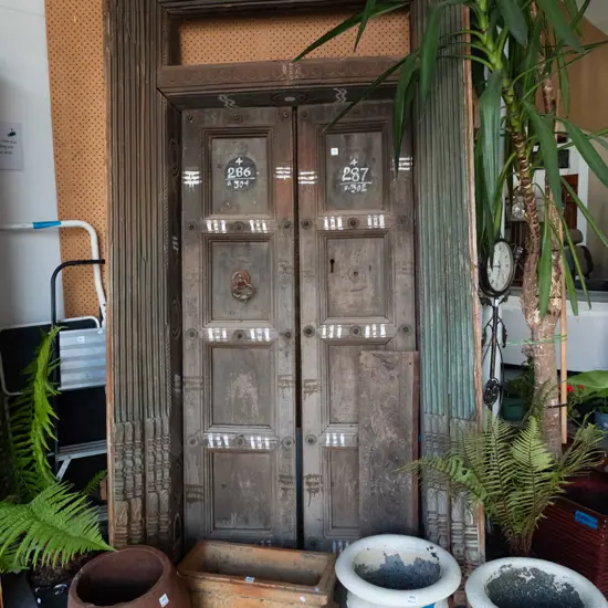 heavy Indian Madurai carved hardwood entrance door - 2 doors, cast metal drop handle, metal studding
