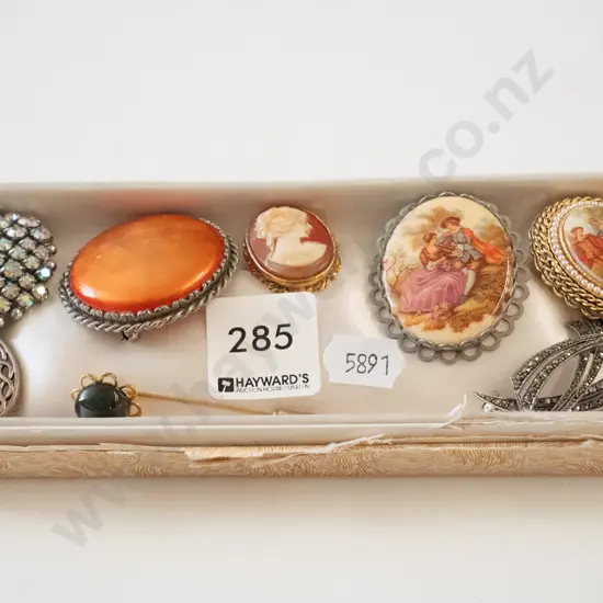 tray of brooches