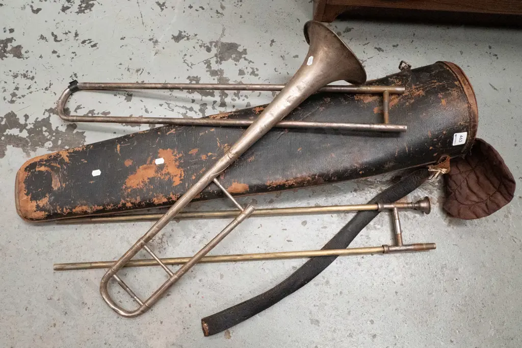 vintage trombone in battered carry case Image 1++