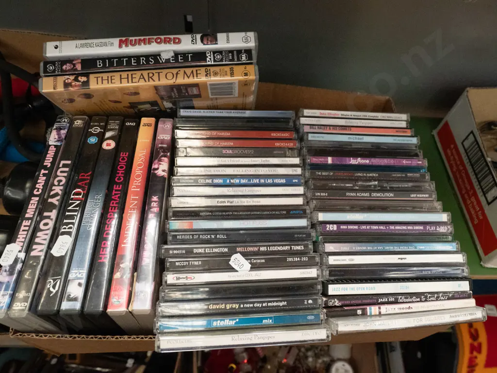 box of DVDs and CDs Image 1++