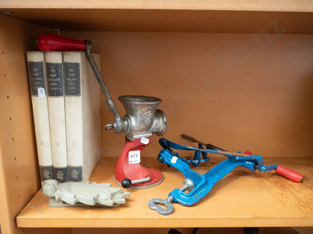 3x volumes of NZ study guide, mincer, door knocker, bench top apple peeler Image 1++