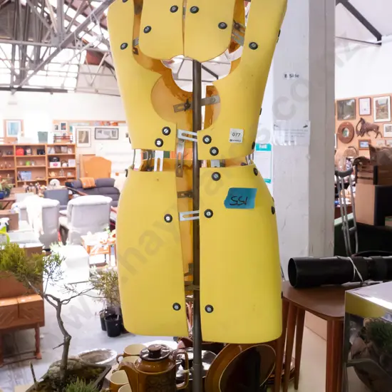 yellow dressmakers form on stand