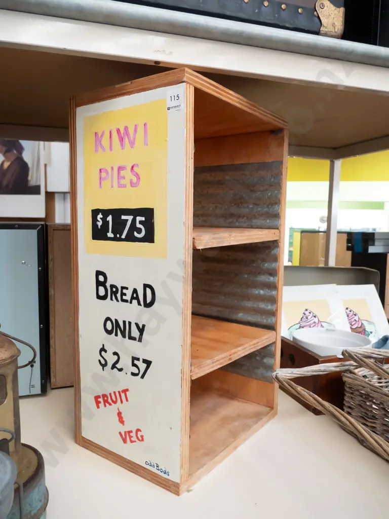 home made adjustable bookcase with hand painted advertising signs Image 1++