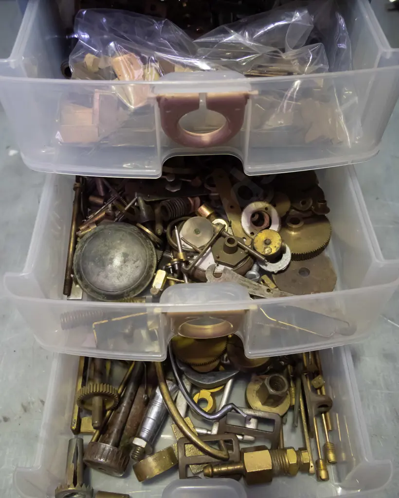 small 3 drawer plastic storage chest with numerous brass and copper  pieces Image 1++