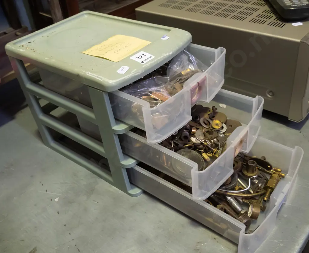 small 3 drawer plastic storage chest with numerous brass and copper  pieces Image 1++