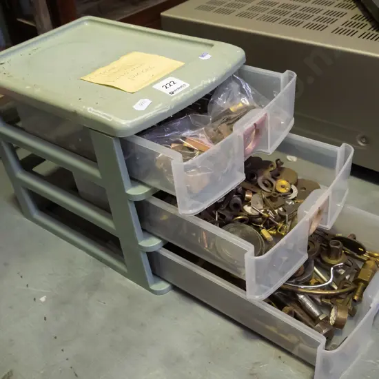 small 3 drawer plastic storage chest with numerous brass and copper  pieces
