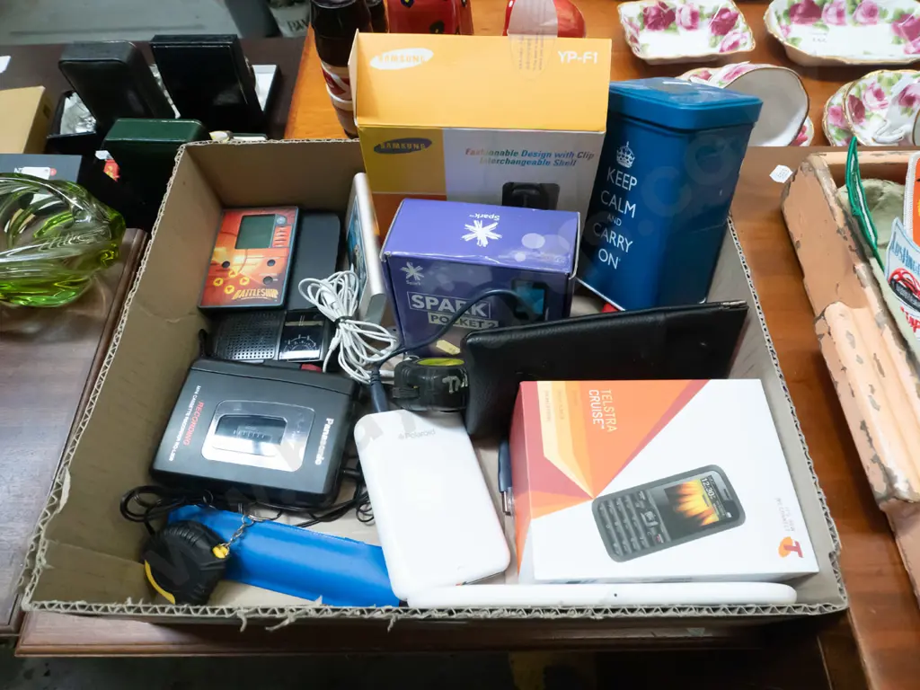 box; cell phones, Samsung music player, tape measures, cassette players etc Image 1++