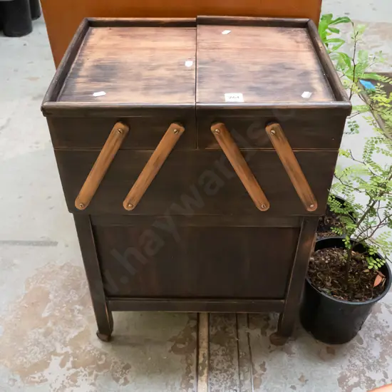 sewing concertina on stand - varnish needs attention