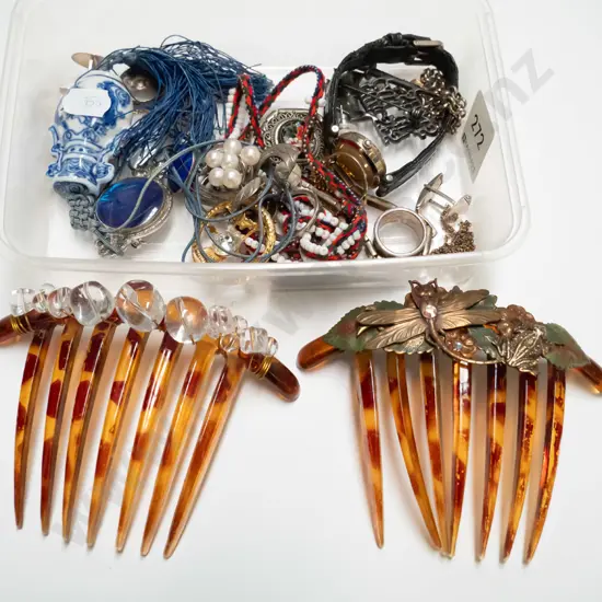 tray of hair combs, watch