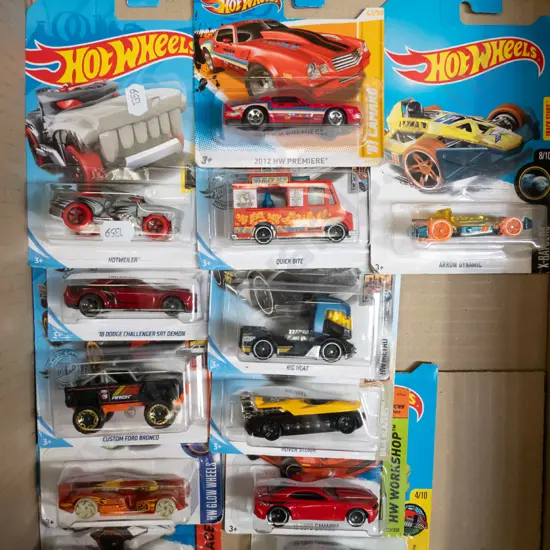 box of Hot Wheel vehicles