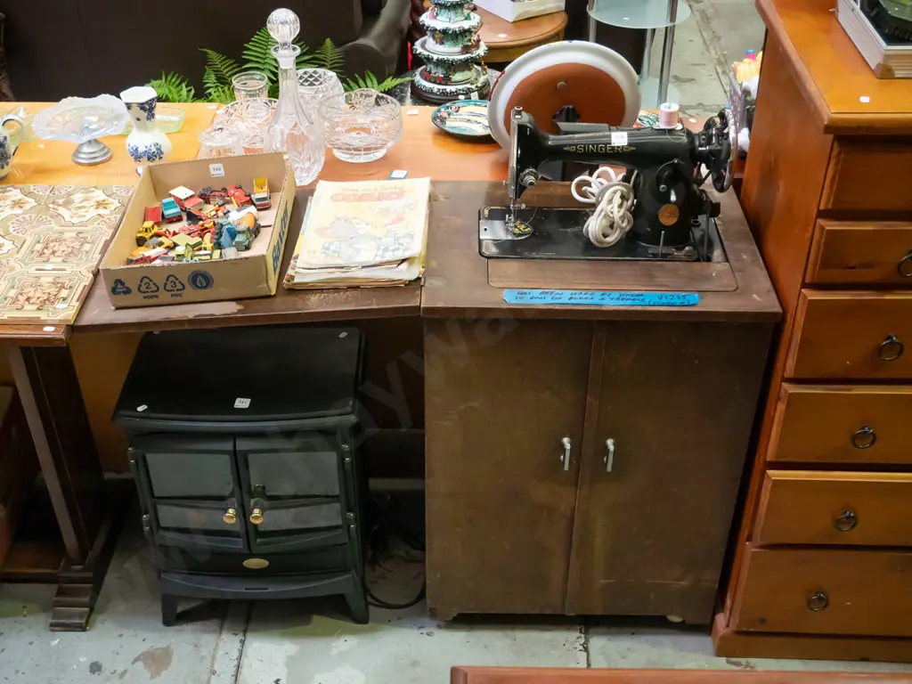 Singer treadle/electric sewing machine in cabinet - cabinet needs attention Image 1++