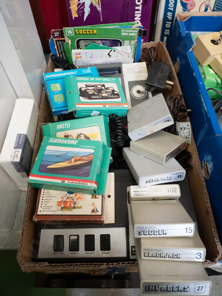 2 boxes of various Hanimex, Tempest & other home video consoles, accessories and game cartridges - As Is, No Returns Image 1++