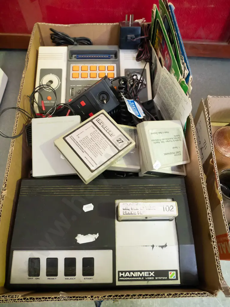 2 boxes of various Hanimex, Tempest & other home video consoles, accessories and game cartridges - As Is, No Returns Image 1++