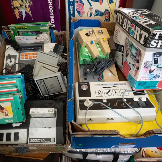2 boxes of various Hanimex, Tempest & other home video consoles, accessories and game cartridges - As Is, No Returns