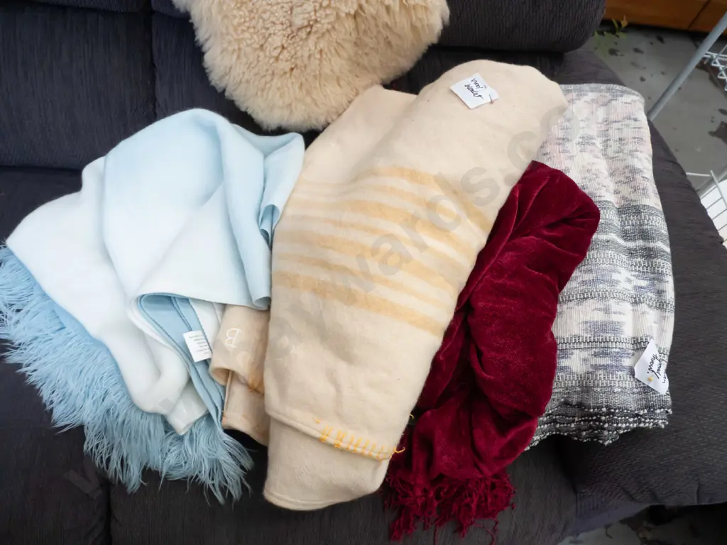 bundle of wool and other blankets Image 1++
