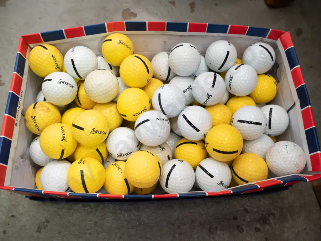 shoe box of driving range golf balls Image 1++