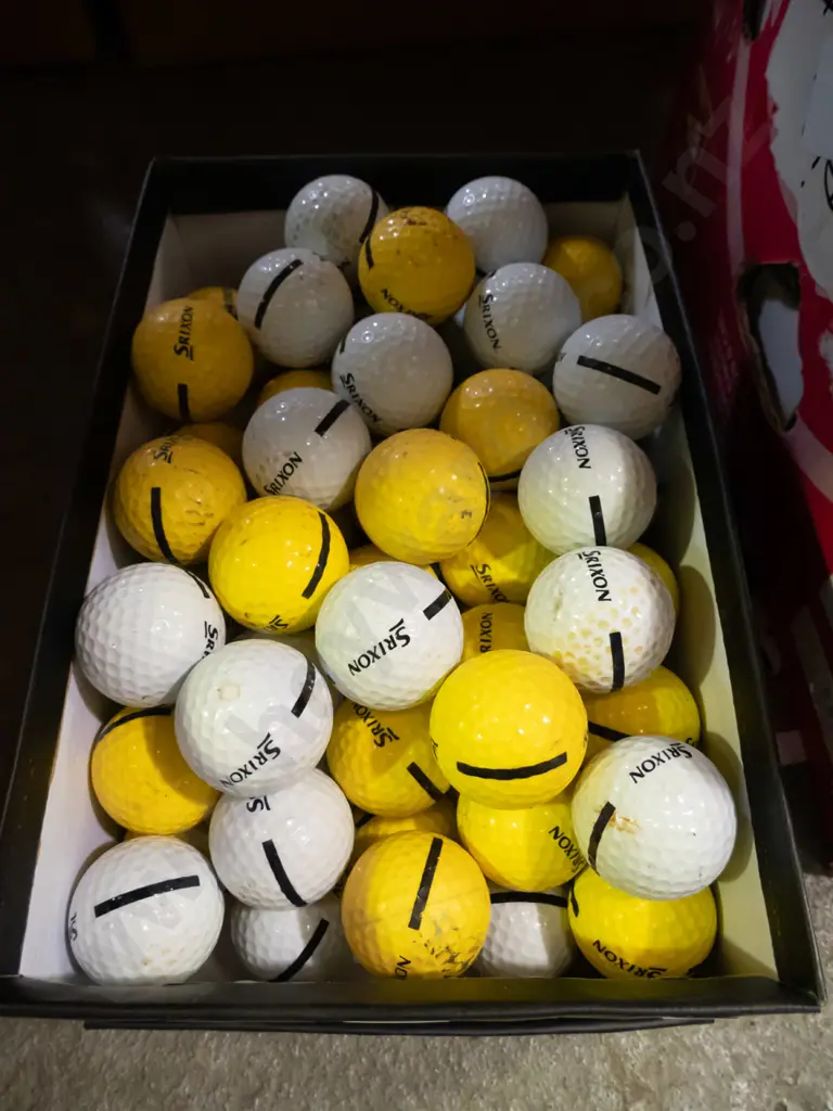 shoe box of driving range golf balls Image 1++