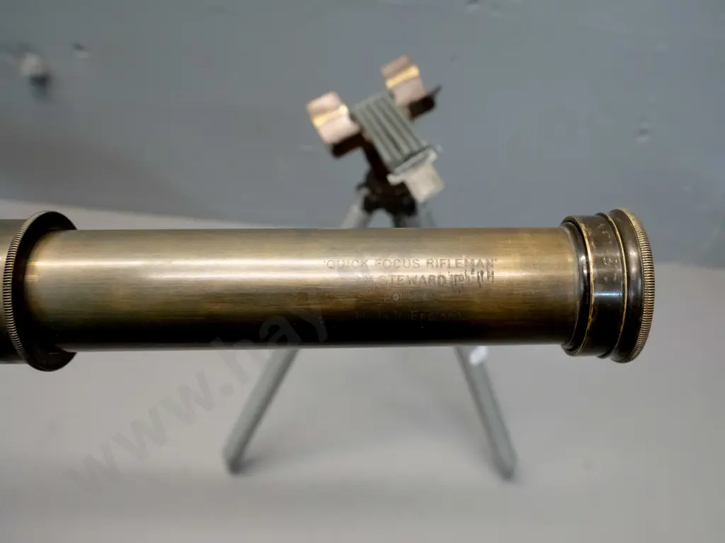 vintage telescope marked Quick Focus Rifleman / JH Steward / made in England with small tripod w/ spring clip mount. Image 1++